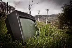 Old forlorn TV on the side of the road